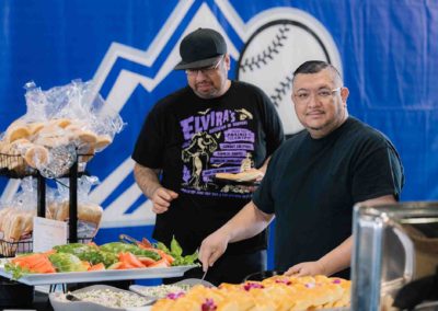 Buffet table with fresh salads and bread at Brannan Company Picnic 2025 in Colorado