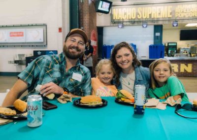 Family enjoying food at Brannan Company Picnic 2025 in Denver, CO