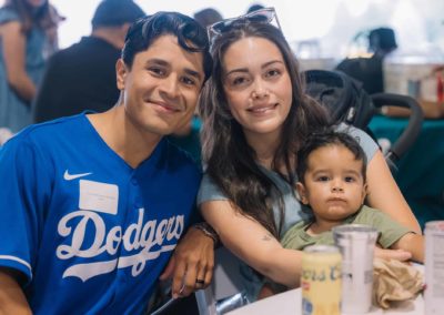 Family seated at a table during the Brannan Companies Picnic 2025 in Colorado.