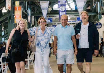 A group of people posing together at the Brannan Companies annual picnic event in Denver, CO.