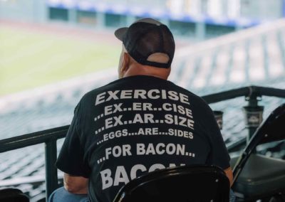 Man sitting in stadium seats at Brannan Company Picnic 2025 in Colorado