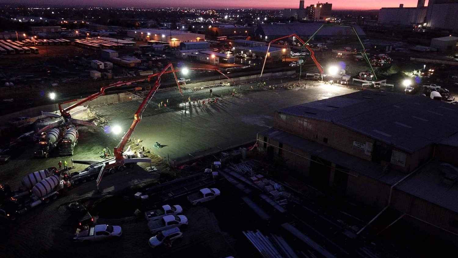 ready-mix-1 Wide view of ready mix pour with crews and machinery under lights in Denver, CO.<br />