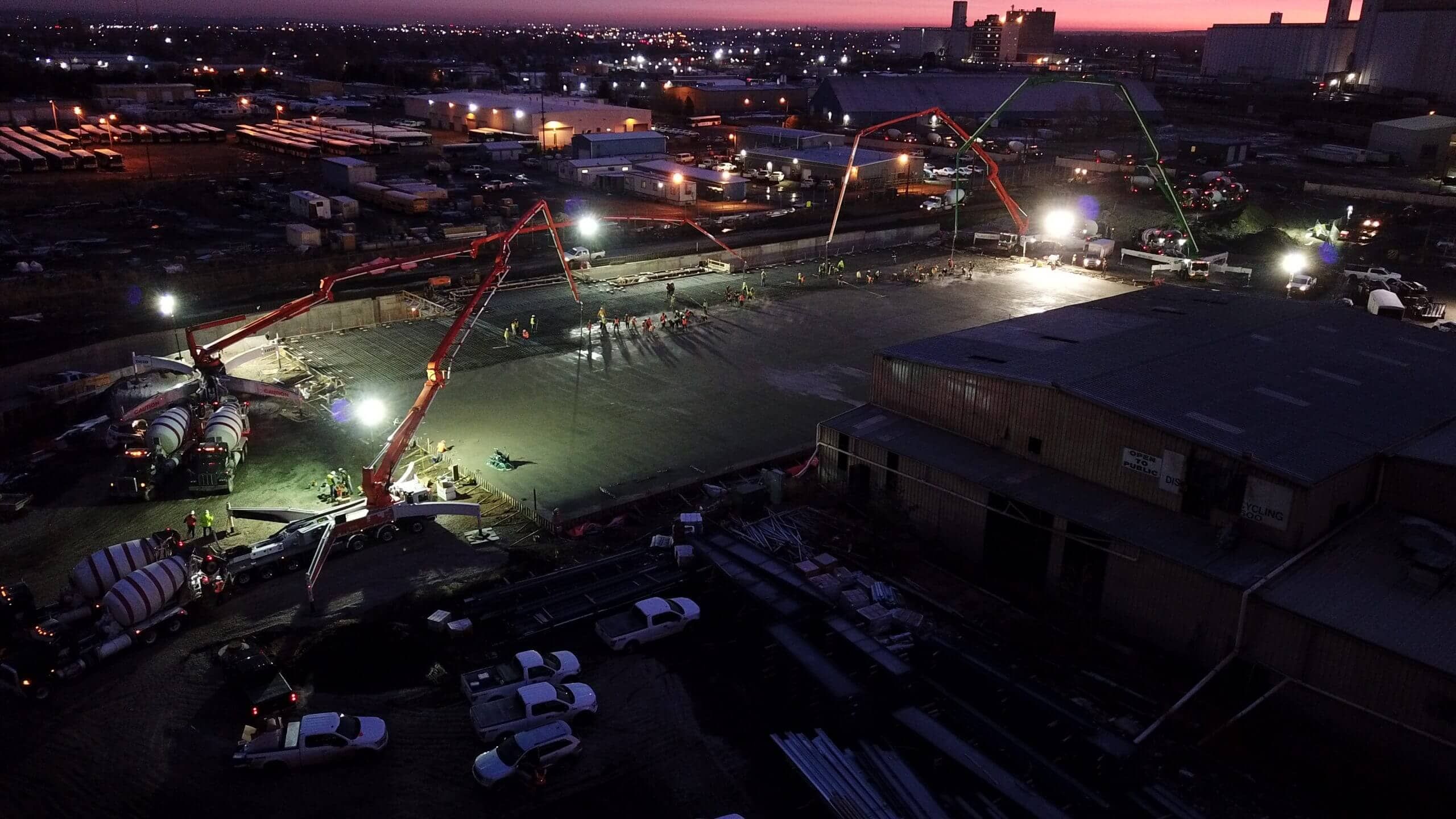 Aerial view of a Denver, CO construction site at dusk, featuring Ready Mix materials and equipment<br />
