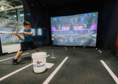 A small boy is playing baseball during the Brannan Companies picnic event in Denver, CO