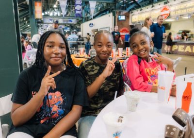 Three girls enjoying ice cream during the Brannan Companies Picnic 2025 in Colorado