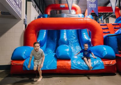 Two boys are having fun at the Brannan Companies Picnic 2025 activity zone in Colorado