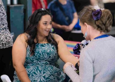 Woman getting a painting design at Brannan Company Picnic 2025 in Colorado