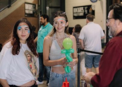 Young girls are posing together at the Brannan Companies annual picnic event in Denver, CO